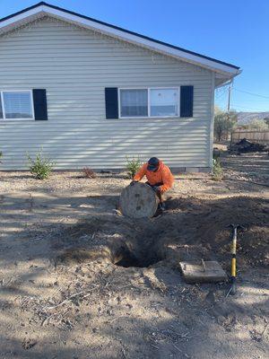 Uncovered septic lids and the front hole where a new riser was installed.