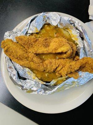 Baked potato with catfish and crawfish etoufee