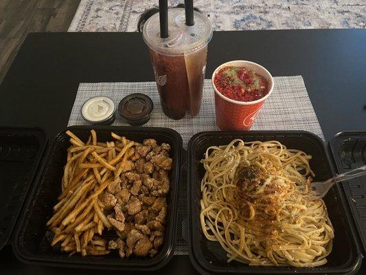 Popcorn chicken, Cajun fries, peach and strawberry iced tea, flaming hot Cheetos elote and garlic noodles