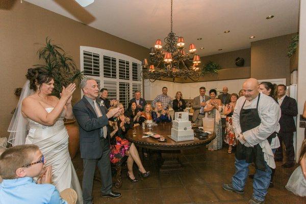 Pat O'Hara takes a bow as he's applauded by all the party guests.