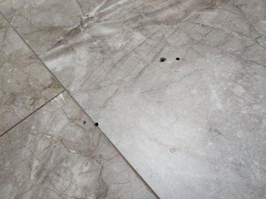 Holes in vinyl flooring upon install