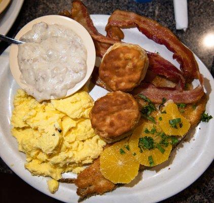 Trout with eggs and added bacon, biscuits and gravy