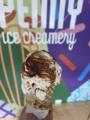 Toasted marshmallow fluff, overflowing on a house made waffle cone!