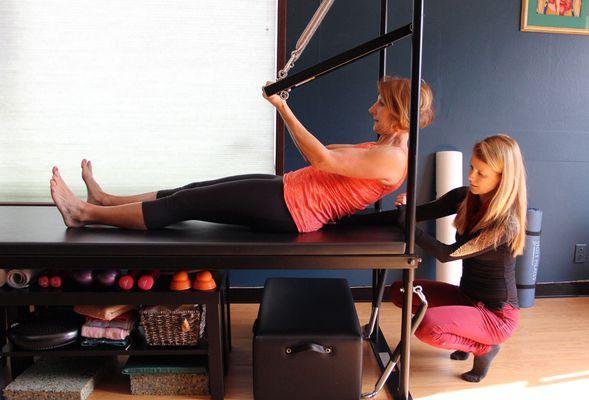 Susan B. Stack, working with Pilates client for functional movement and strength