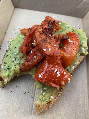 Perfectly constructed Avocado toast. Fluffy avocado and seasoned tomatoes:)