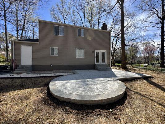 New raised patio with Belgard wall block and Stamped concrete finish!