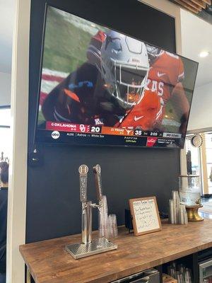 Watch some football and grab a beer from the tap.