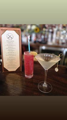 "Luck Be a Lady," with tequila, hibiscus, grapefruit, lime, & a lime wedge; next to it is "The Dean Martini," gin-based with a pearl onion