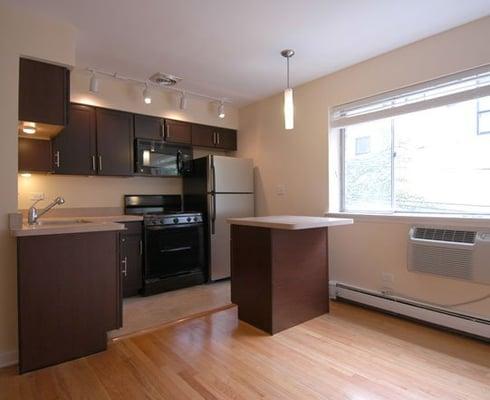 Spacious kitchen. Hardwood floors.