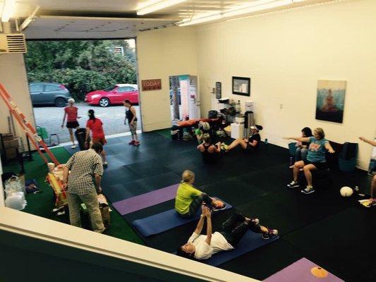 Our big door open to let in the Summer Breeze during a Bootcamp-style class.