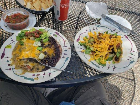 My green enchilada and shredded beef taco with a been tostada under cover.