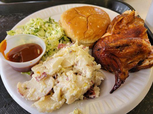 Potato salad with cole slaw, 1/4 chicken, and a small beef sandwich