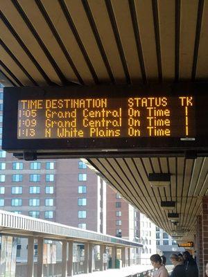 Outdoor train arrival sign.