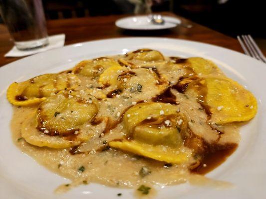 Braised beef short-rib filled ravioli with a sage brown butter sauce and breadcrumbs.