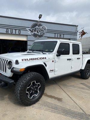 Jeep gladiator on front of the shop