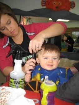 My son in one of the kid stations - a boat!