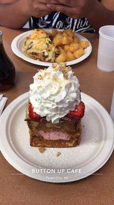 Corned beef hash egg benny with tater tots and the strawberry cheesecake french toast