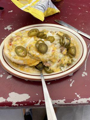 green chile burger with cheese, onions and jalapeno.