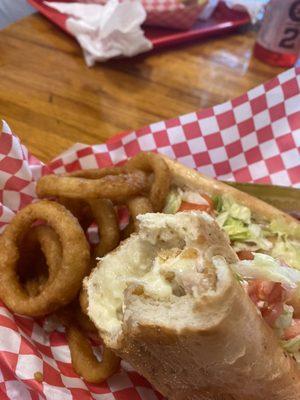 Chicken cutlet sandwich with onion rings