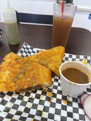 Quessabirria with consume and Tamarindo water