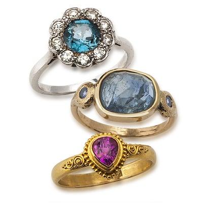 Sapphire set in platinum with diamond halo ring, bezel-set sapphire set in 14 karat gold ring and pink sapphire set in 22k ring.