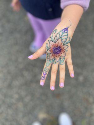 My daughter's henna with glitter