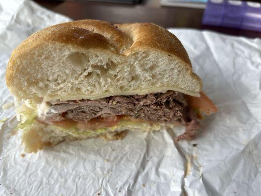 Roast beef sandwich with Swiss cheese lettuce tomato and mayo