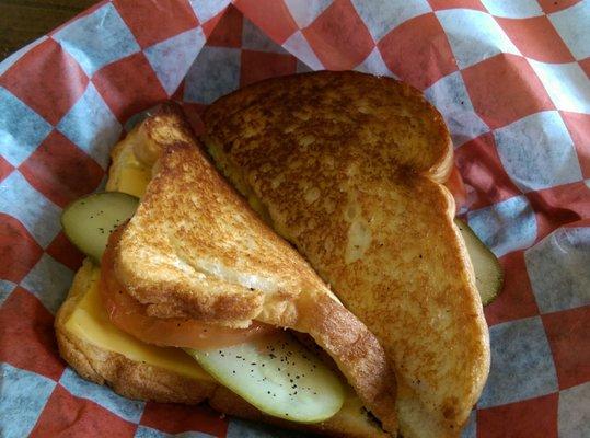 My grilled cheese sandwich after I added a delicious slice of dill pickle, a tomato slice, and a sprinkle of onions. Perfect.