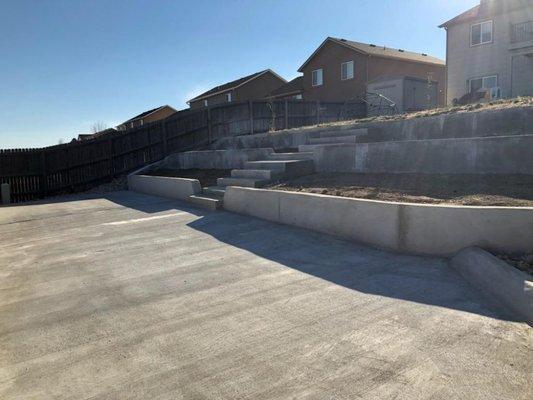 Backyard terracing- Fountain : Concrete retaining walls and pad with steps