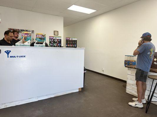 The owners and Raffo at the locksmith shop