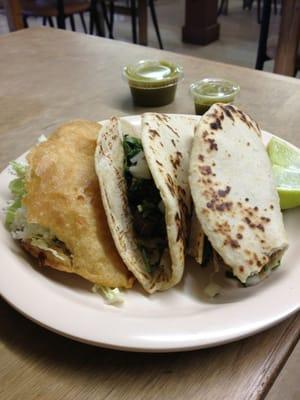 One quesadilla, one lengua taco, one shredded pork taco