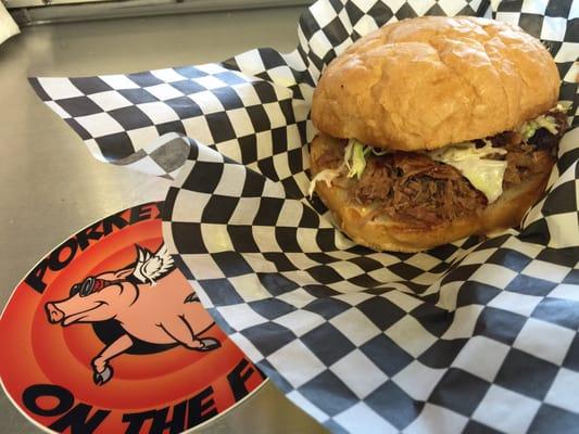 Porky D's Famous Original. Tender Pulled pork with unique savory spice topped with homemade angel hair slaw on a toasted roll.