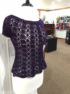 A peak into our shop and look at this beautiful crocheted top out of @sweetgeorgia tough love sock in Ultraviolet.