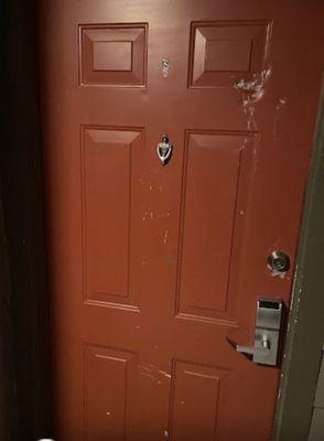 Front door with questionable integrity. Obvious that it had been attempted to be broken into