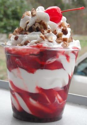 Classic sundaes include whipped cream, nuts and a cherry.