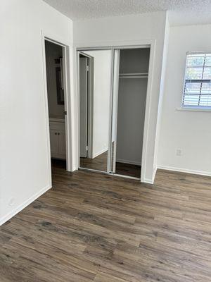 Bedroom with mirrored closet doors