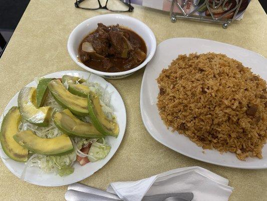 Goat, rice and salad