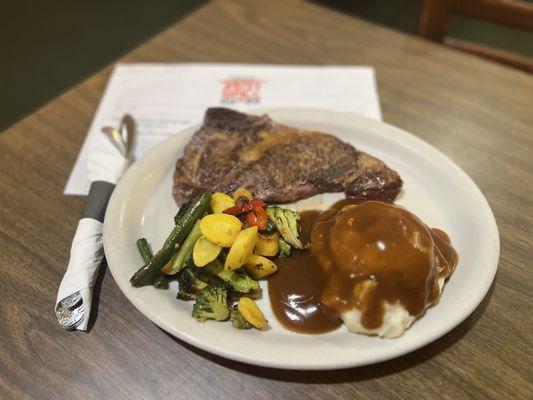 Ribeye steak with mashed potatoes, gravy and buttery veggies. What more do you need?