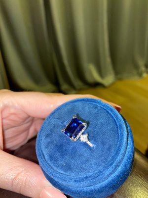 Custom engagement ring. Sapphire with diamond side stones and diamond and platinum band.