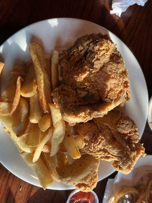 4 pieces of what they call on the menu Broasted Chicken with steak fries.