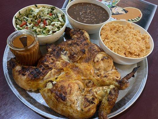 A whole Roast Chicken with rice, Beans, Salad, tortillas and salsa for an amazing price.