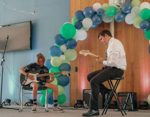 Jammin' on the electric guitar! It was a ROCKIN' performance.