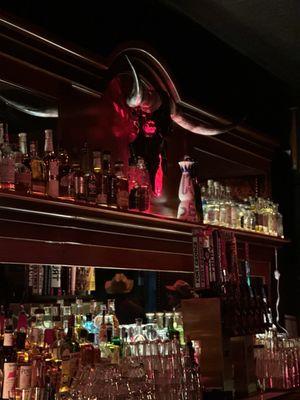 Inside, fierce steer watches over the bar, Santanico would be proud.