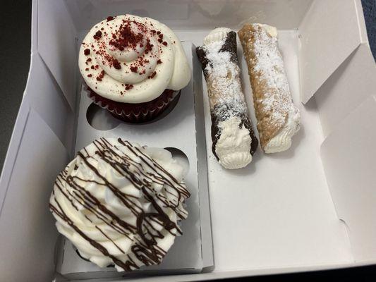 Red velvet cupcake and cannolis.