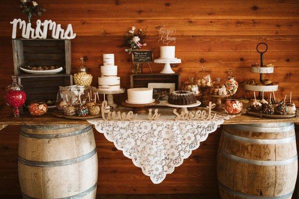 Dessert table - 3 white cakes (lemon poppyseed, carrot, and chocolate mudslide) with buttercream frosting, were perfect for our wedding.