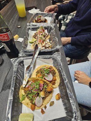 Chorizo, carne asada and Santo Taco from bottom up.