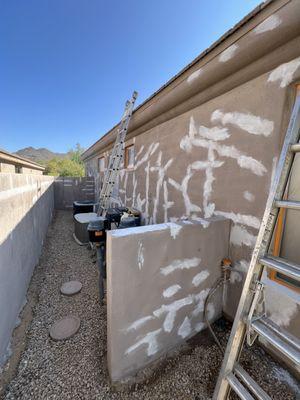 Prep work fixing the cracks with acrylic synthetic stucco