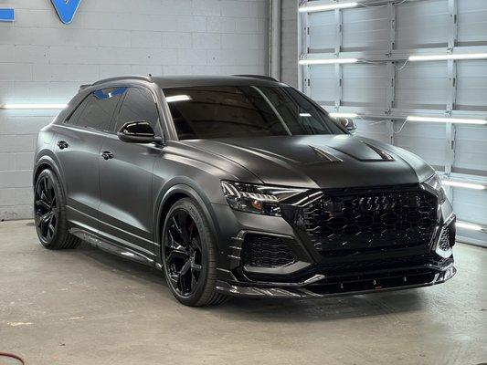 Audi RSQ8 with a satin black colored paint protection film. Also customized with many extras.