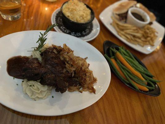 Ribeye steak served on top of these delicious mashed potatoes with caramelized onions on top.