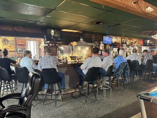 Busy bar, smokey from the grill